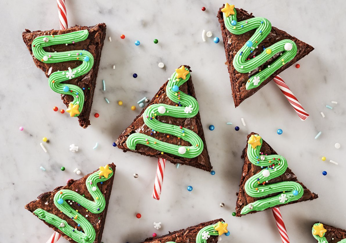 Brownies, cut into triangles, with green icing drizzled.