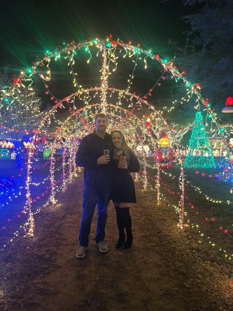 People enjoy the holiday lights at a home featured in the Austin tour.