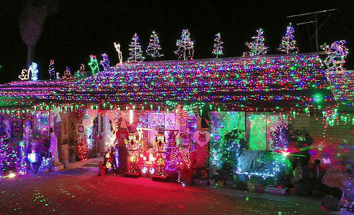 House elaborately decorated with Christmas lights